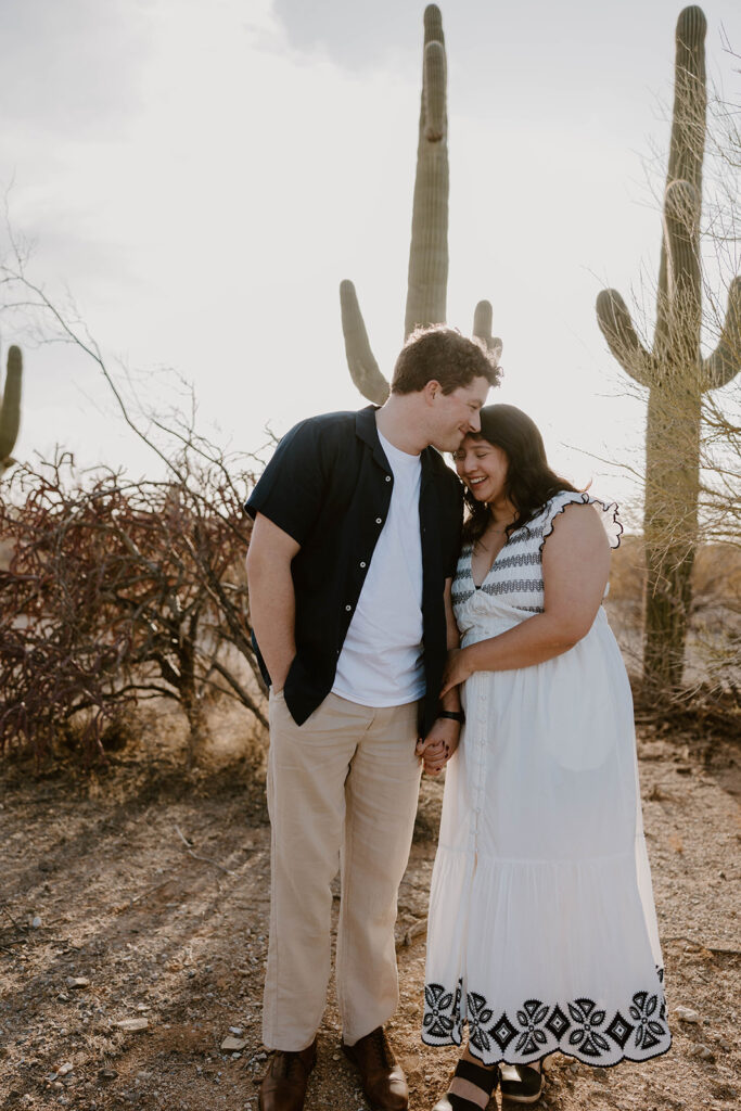 Couple holding hands during their session at sunset
