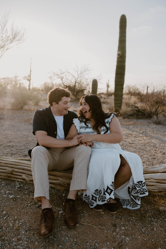 Couple laughing together during their Arizona engagement photoshoot