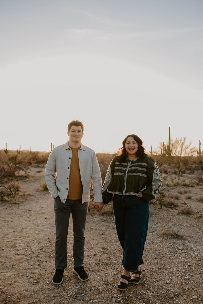 Engaged couple embracing in the desert at sunset — Tucson engagement photography