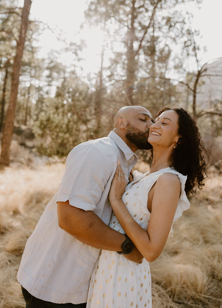 Couple laughing together during their Arizona engagement photoshoot
