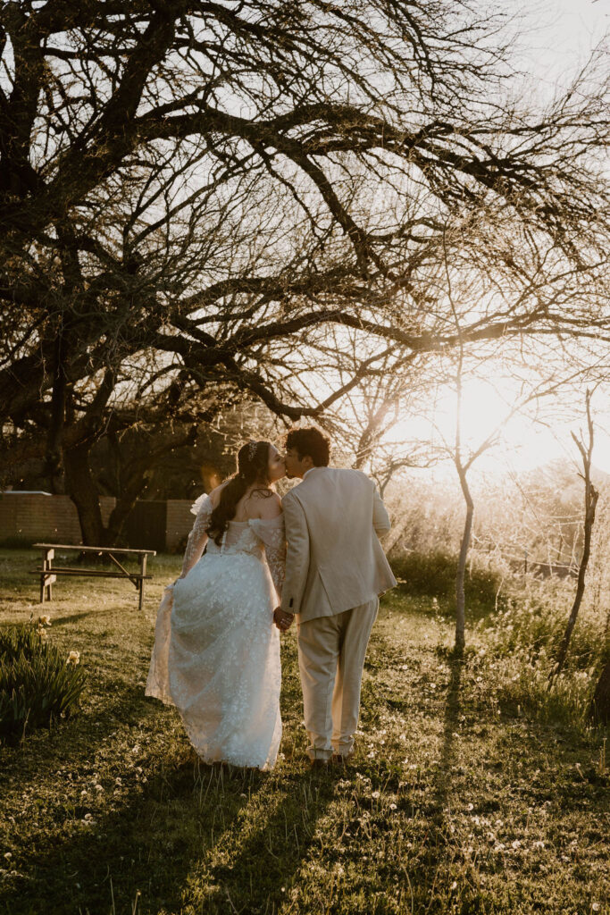 Tucson based, Arizona Micro Wedding Photographer takes garden party wedding photos bride and groom at golden hour at Agua Linda Farm