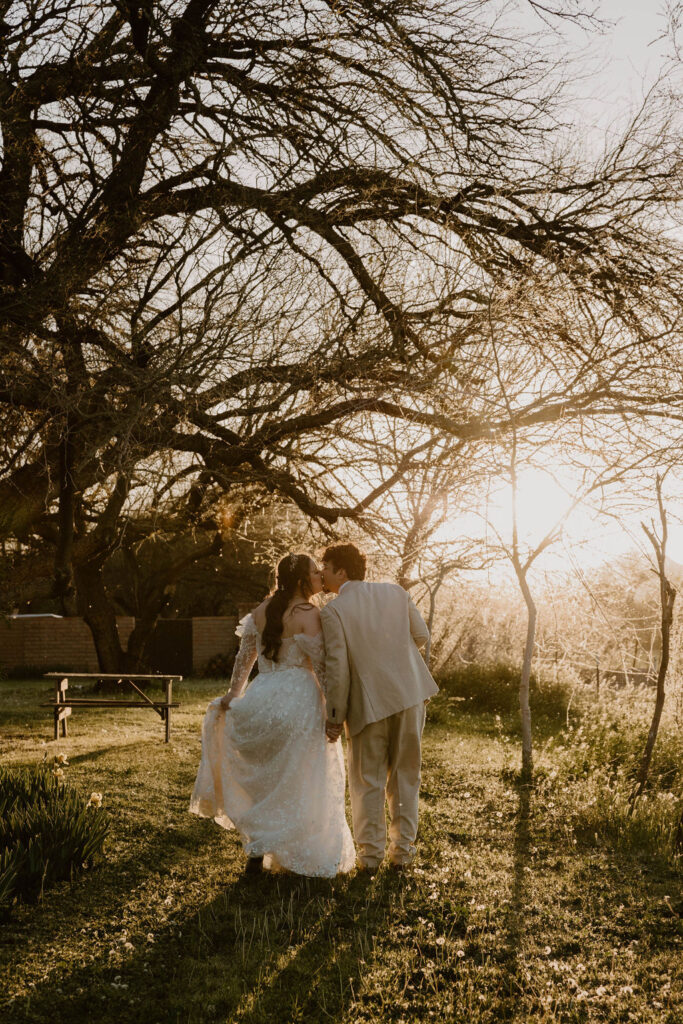 Tucson based, Arizona Micro Wedding Photographer takes garden party wedding photos golden hour bride and groom
