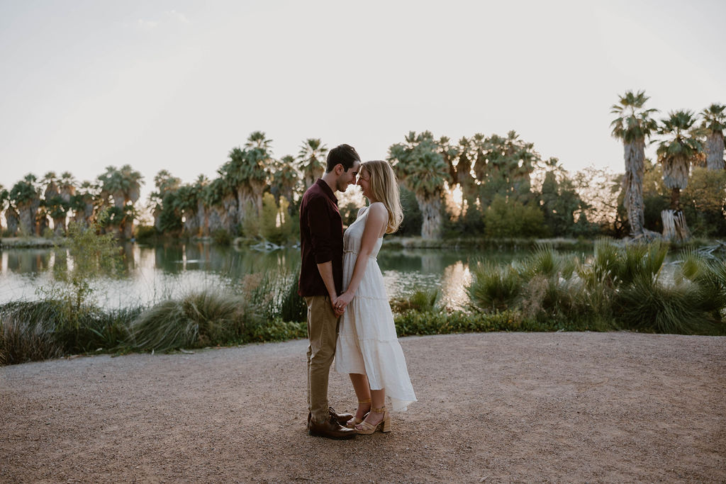 Engaged couple embracing in the desert at sunset — Tucson engagement photography