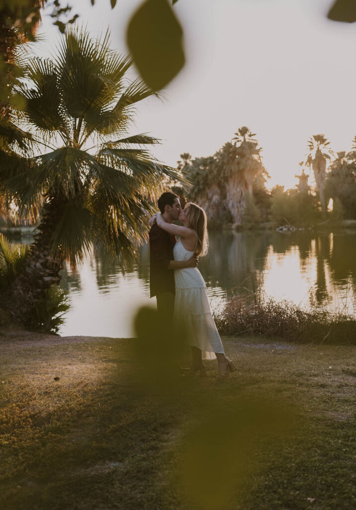 Engaged couple embracing in the desert at sunset — Tucson engagement
