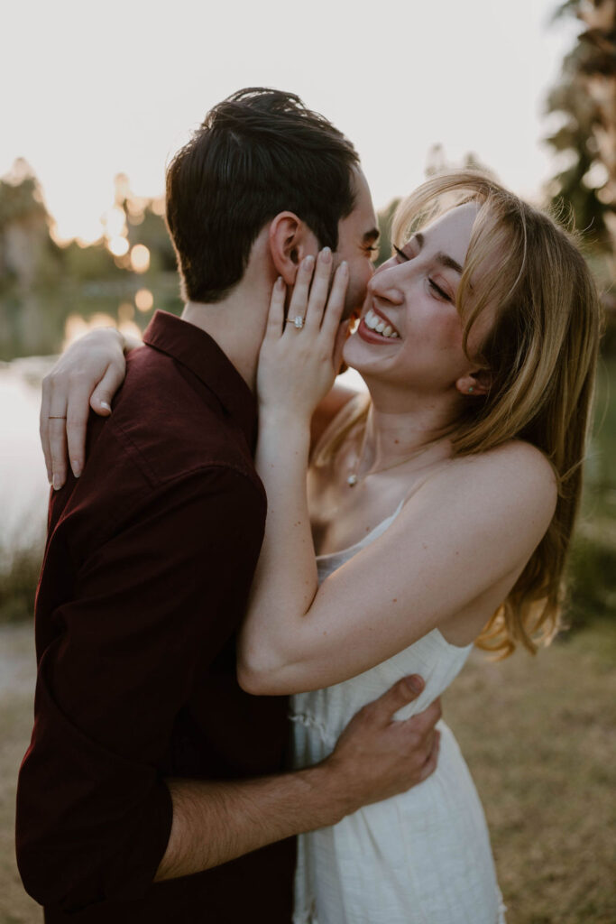 Couple holding hands during their photoshoot  at sunset